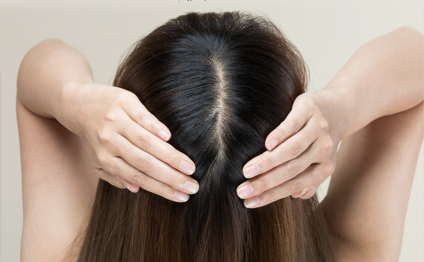 Woman pulling hair back